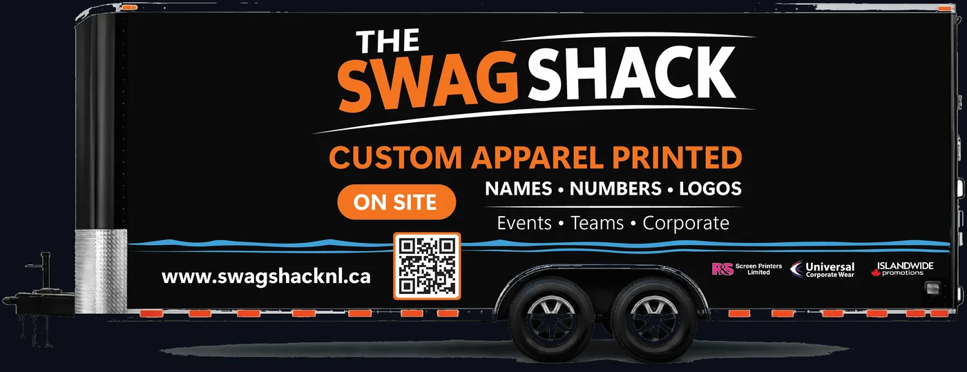 The Swag Shack mobile print trailer, wrapped in black and orange, reading Custom Apparel Printed On Site